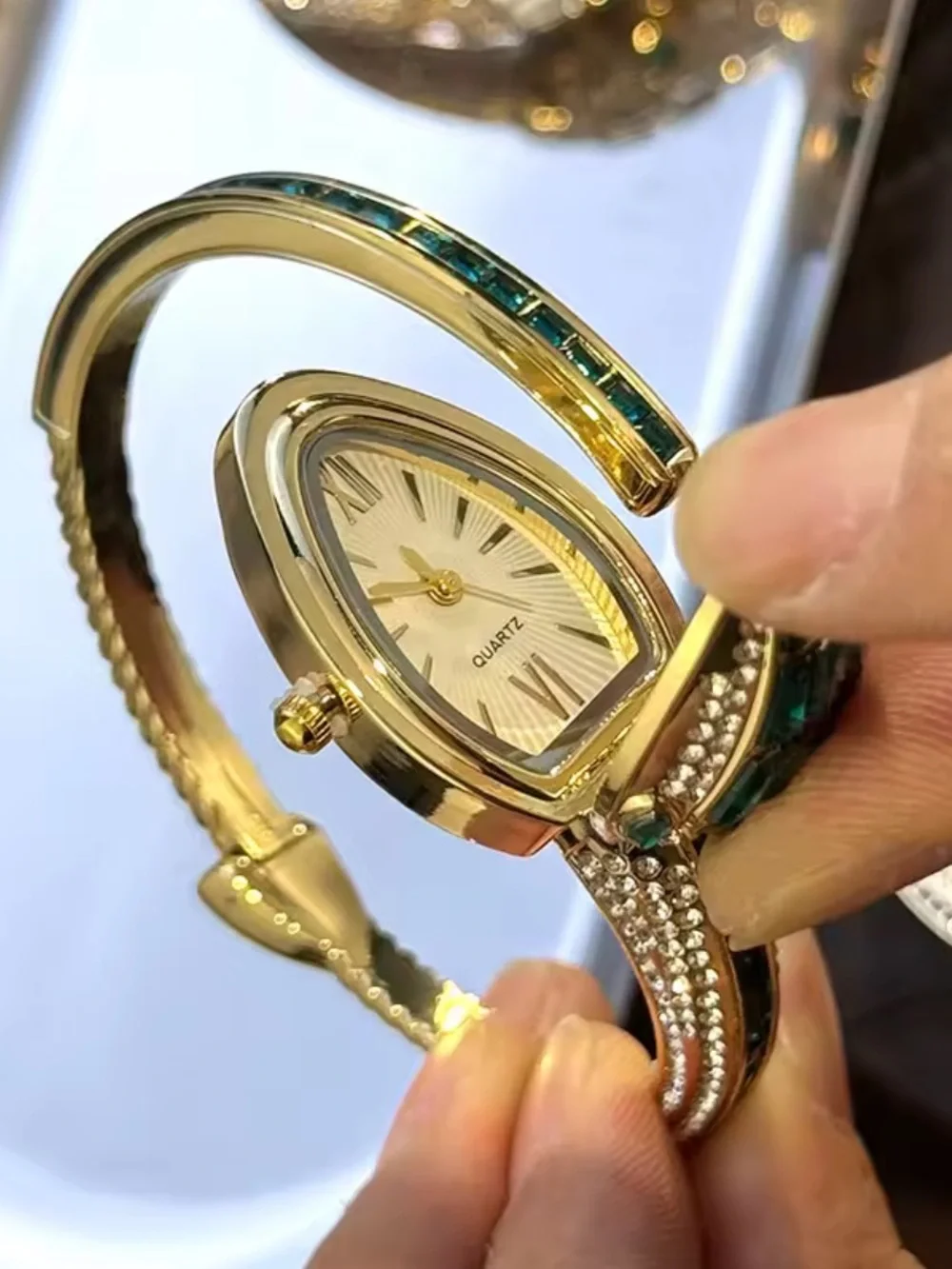 Gold-Tone Serpent Cuff Watch with Emerald Green Crystals